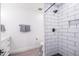 Modern bathroom featuring sleek white subway tile shower with black accents at 6831 E Presidio Rd, Scottsdale, AZ 85254
