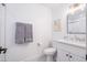Clean bathroom featuring a white vanity, a toilet, and a shower with classic white subway tile at 6831 E Presidio Rd, Scottsdale, AZ 85254