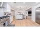 Bright kitchen with white cabinets, stainless steel appliances and open floor plan at 6831 E Presidio Rd, Scottsdale, AZ 85254