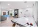 Spacious living area with a charming fireplace and an inviting air hockey table at 6831 E Presidio Rd, Scottsdale, AZ 85254
