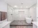 Modern main bathroom with a stand-alone tub and walk-in shower with sleek tile work and recessed lighting at 6831 E Presidio Rd, Scottsdale, AZ 85254