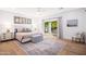 Serene main bedroom with a neutral color palette and sliding glass door leading to the backyard at 6831 E Presidio Rd, Scottsdale, AZ 85254