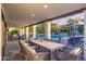 Inviting covered patio with outdoor dining area, lounge, and pool views at 6831 E Presidio Rd, Scottsdale, AZ 85254
