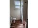 This bathroom features a sink, toilet, wood floors, and natural light from the window at 7251 E Grouse Ct, San Tan Valley, AZ 85143