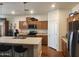 Open kitchen featuring a large island, stainless steel appliances, and ample cabinet storage at 7251 E Grouse Ct, San Tan Valley, AZ 85143