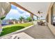 Well-maintained backyard featuring a covered patio, manicured lawn, a grilling area and a gardening enclosure at 747 E Meadow Ln, Phoenix, AZ 85022
