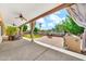 Inviting backyard with a covered patio, outdoor seating, a lush lawn, a gardening enclosure and a grill area at 747 E Meadow Ln, Phoenix, AZ 85022