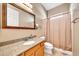 Bathroom with granite countertop vanity, decorative mirror and neutral paint at 747 E Meadow Ln, Phoenix, AZ 85022