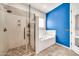 Bathroom featuring a large shower with glass door and separate tub beneath a window at 747 E Meadow Ln, Phoenix, AZ 85022