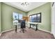 Green bedroom with large window and desk area for home office at 747 E Meadow Ln, Phoenix, AZ 85022