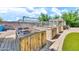Raised garden beds, partially enclosed with netting, sit on a paved path in the backyard at 747 E Meadow Ln, Phoenix, AZ 85022