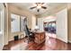 Office with exterior view, large wooden desk and doorway to living area at 747 E Meadow Ln, Phoenix, AZ 85022