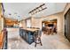 Spacious kitchen with an island, bar seating and views to the living room and dinette at 747 E Meadow Ln, Phoenix, AZ 85022