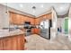 Well-lit kitchen featuring wooden cabinets, stainless steel appliances, and granite countertops at 747 E Meadow Ln, Phoenix, AZ 85022