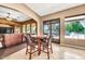 Open living space with bar height dining table, view to the living room and view to the backyard at 747 E Meadow Ln, Phoenix, AZ 85022