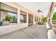 Inviting patio with tiled flooring, outdoor seating, and views of a well-maintained backyard and grilling area at 747 E Meadow Ln, Phoenix, AZ 85022