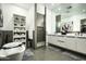 Elegant bathroom with a free-standing tub, a glass enclosed shower, and modern vanity with dual sinks at 7614 E Cactus Wren Rd, Scottsdale, AZ 85250