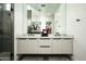 Modern bathroom vanity with dual sinks, sleek fixtures, and ample counter space, perfect for a stylish and functional space at 7614 E Cactus Wren Rd, Scottsdale, AZ 85250