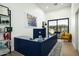 Modern home office with a spacious desk, sleek shelving, and a comfortable chair, creating a productive workspace at 7614 E Cactus Wren Rd, Scottsdale, AZ 85250