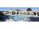 Sparkling community swimming pool with covered seating areas and plenty of space to lounge in the sun at 7614 E Cactus Wren Rd, Scottsdale, AZ 85250