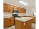 Functional kitchen with stainless steel appliances and spacious center island at 8924 E Portobello Ave, Mesa, AZ 85212