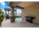 Charming backyard patio with a built-in grill and a swimming pool at 9834 E Thatcher Ave, Mesa, AZ 85212