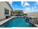 A refreshing pool offers beautiful waterfalls and a pergola with seating, creating a perfect backyard oasis at 9834 E Thatcher Ave, Mesa, AZ 85212
