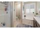A well-lit bathroom features a walk-in shower, separate tub, and modern fixtures for a spa-like experience at 9834 E Thatcher Ave, Mesa, AZ 85212