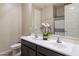 Bright bathroom featuring double sinks and a decorative orchid at 9834 E Thatcher Ave, Mesa, AZ 85212