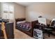 Comfortable bedroom featuring a wooden bed frame and decor at 9834 E Thatcher Ave, Mesa, AZ 85212