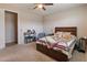 This comfortable bedroom includes a queen bed, neutral walls, and soft carpeting to create a relaxing retreat at 9834 E Thatcher Ave, Mesa, AZ 85212