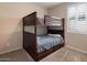 Bedroom featuring a wooden bunk bed and a carpeted floor at 9834 E Thatcher Ave, Mesa, AZ 85212