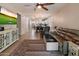 A spacious living room provides an open concept layout with wood floors, stylish furnishings, and lots of natural light at 9834 E Thatcher Ave, Mesa, AZ 85212