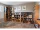 Well-lit office with carpeted floors and built-in bookshelves at 9834 E Thatcher Ave, Mesa, AZ 85212