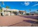 Beautiful backyard with patios and mature palm trees, offering a private outdoor space at 988 W Crooked Stick Dr, Casa Grande, AZ 85122