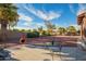 Relaxing backyard space with comfortable seating, showcasing desert landscaping, a clay chimenea and private area at 988 W Crooked Stick Dr, Casa Grande, AZ 85122