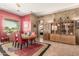 Charming dining room features a round table, comfortable seating, and plenty of natural light from the nearby window at 988 W Crooked Stick Dr, Casa Grande, AZ 85122