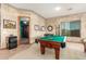 Fun game room includes a pool table, neutral walls, and a cozy atmosphere at 988 W Crooked Stick Dr, Casa Grande, AZ 85122