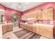 Bright kitchen features wooden cabinets, a gas stove, and ample counter space, perfect for cooking and entertaining at 988 W Crooked Stick Dr, Casa Grande, AZ 85122