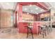 Open-concept kitchen showing bar seating, pendant lighting, and maple cabinets at 988 W Crooked Stick Dr, Casa Grande, AZ 85122