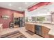 This kitchen features modern stainless steel appliances, ample counter space, and a convenient breakfast bar at 988 W Crooked Stick Dr, Casa Grande, AZ 85122