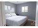 Cozy bedroom featuring neutral tones, comfortable bedding, and ample natural light at 1017 W Piccadilly Rd, Phoenix, AZ 85013