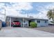 Charming single-story home featuring a carport, long driveway, and easy-care landscaping at 1017 W Piccadilly Rd, Phoenix, AZ 85013
