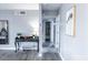Stylish hallway with decorative table, mirror, and artwork, leading to other rooms at 1017 W Piccadilly Rd, Phoenix, AZ 85013