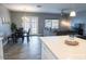 Open-concept living area with dining space and view to the back patio at 1017 W Piccadilly Rd, Phoenix, AZ 85013