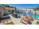 Enjoy outdoor living in this backyard with a refreshing pool and dining area at 1020 E Vermont Ave, Phoenix, AZ 85014