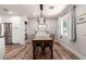 Bright dining room with modern lighting, built-in cabinets, and a wooden dining table at 1020 E Vermont Ave, Phoenix, AZ 85014