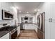 Bright kitchen featuring stainless steel appliances, white cabinets, and an open design at 1020 E Vermont Ave, Phoenix, AZ 85014
