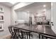 Modern kitchen with stainless steel appliances, stylish bar stools, and a bright, open design at 1020 E Vermont Ave, Phoenix, AZ 85014