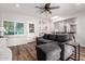 Cozy living room with wood floors, a ceiling fan, and open access to the kitchen at 1020 E Vermont Ave, Phoenix, AZ 85014
